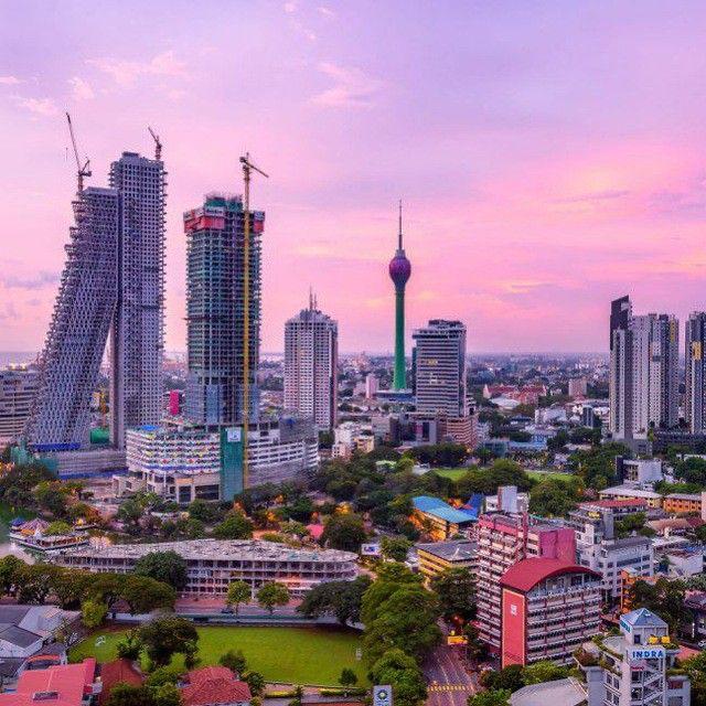 Sunrise over Colombo city with pink skies and the Lotus Tower